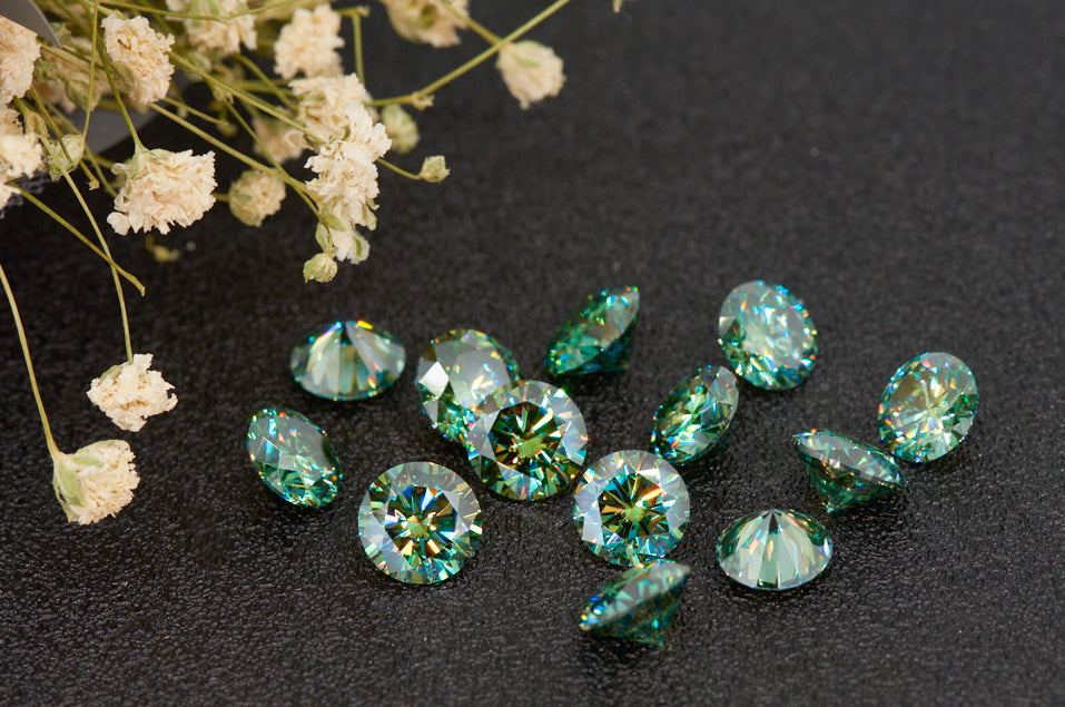 a collection of green round cut moissanite stones on black background, dried flowers as details