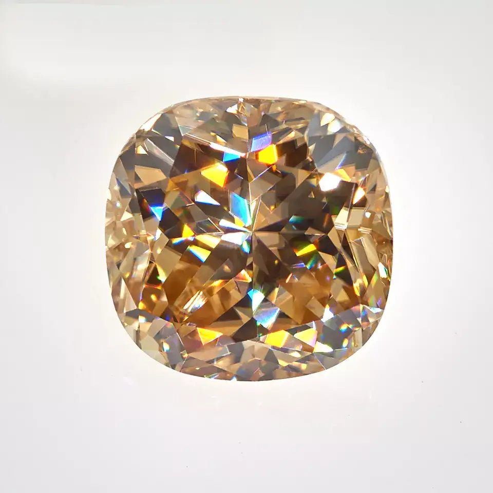 yellow cushion cut moissanite stone on off white background