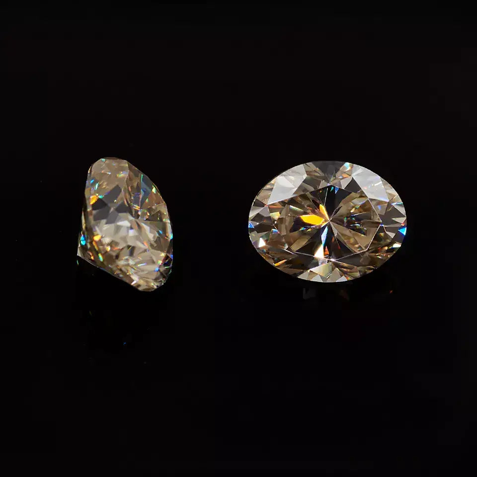 yellow oval cut moissanite stone, top and side view on black background